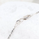 Cadena con cruz de diamantes en oro blanco 18K
